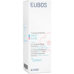 Weiße Verpackung mit blauer Schrift für eine Creme gegen trockene Kinderhaut.